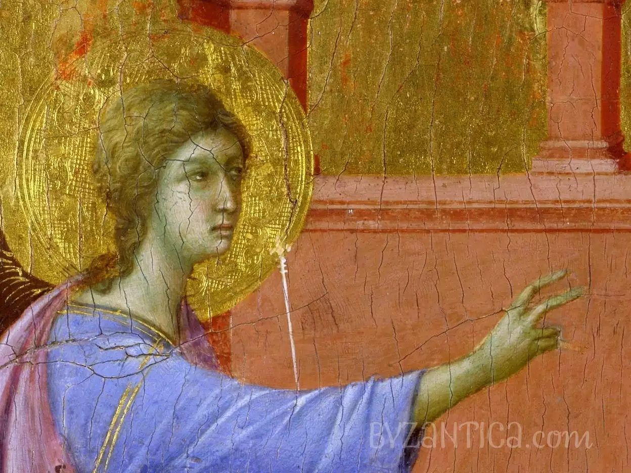 A detail of Duccio's Annunciation tempera painting showing Gabriel's face against golden background