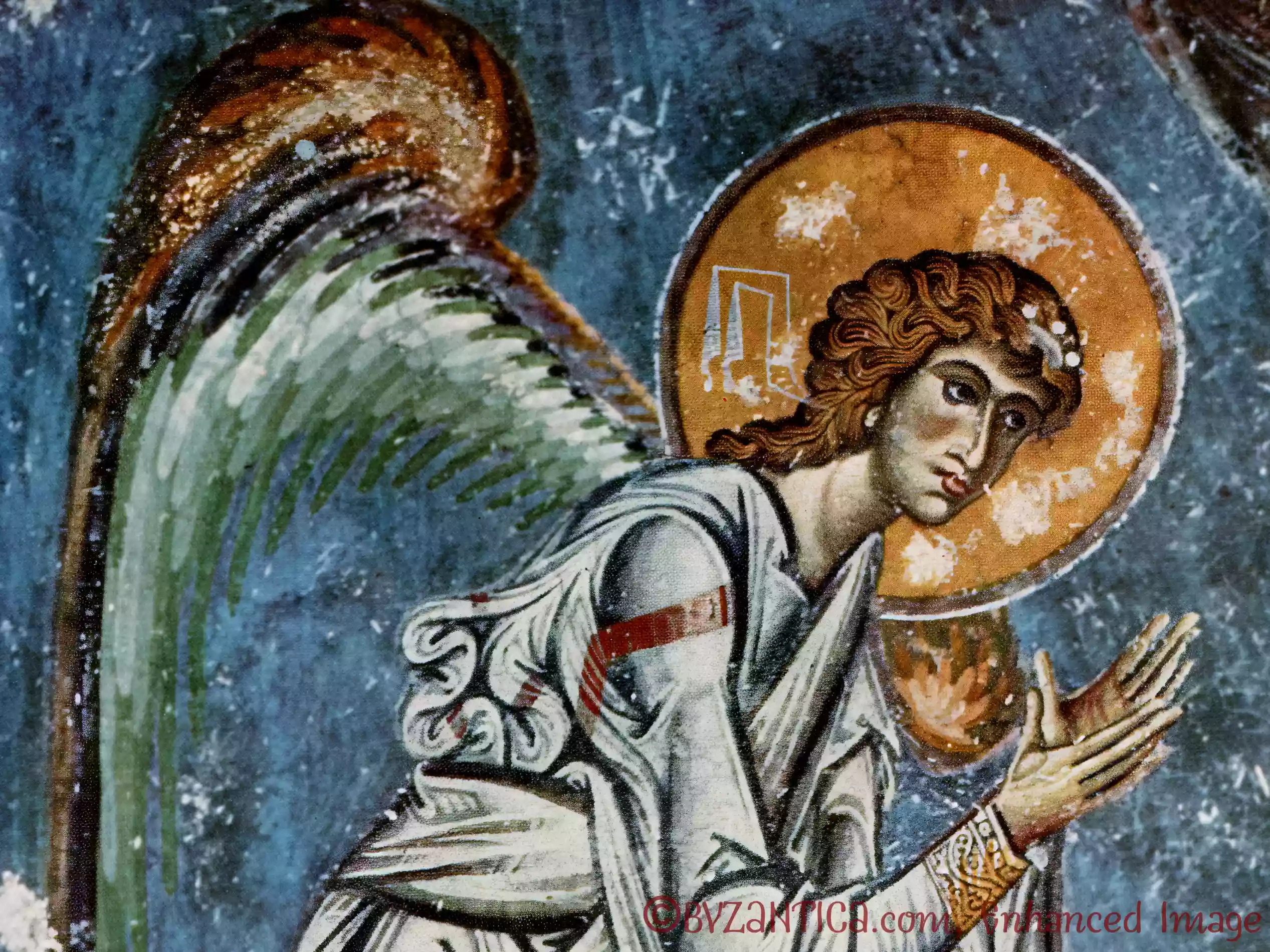 A close-up detail of an angel's face in the angel frieze from Saint Sophia fresco with golden nimbus