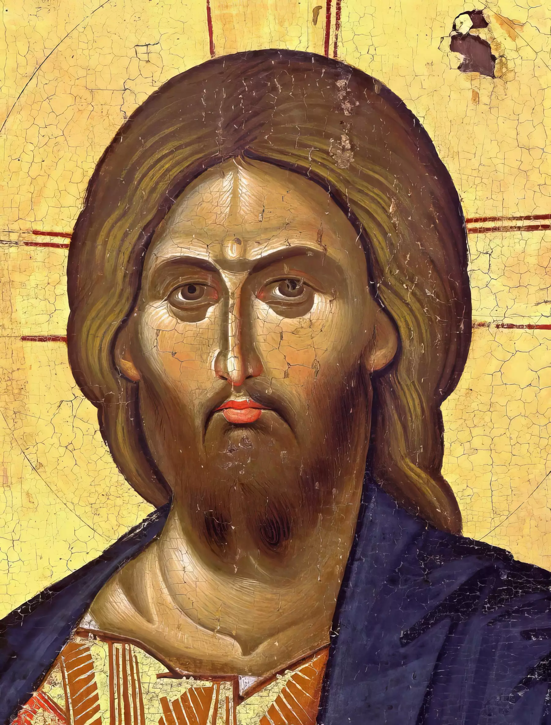 Detail view of Christ's face from 13th century Byzantine icon at Vatopedi Monastery - intense gaze, ochre tones, gold background