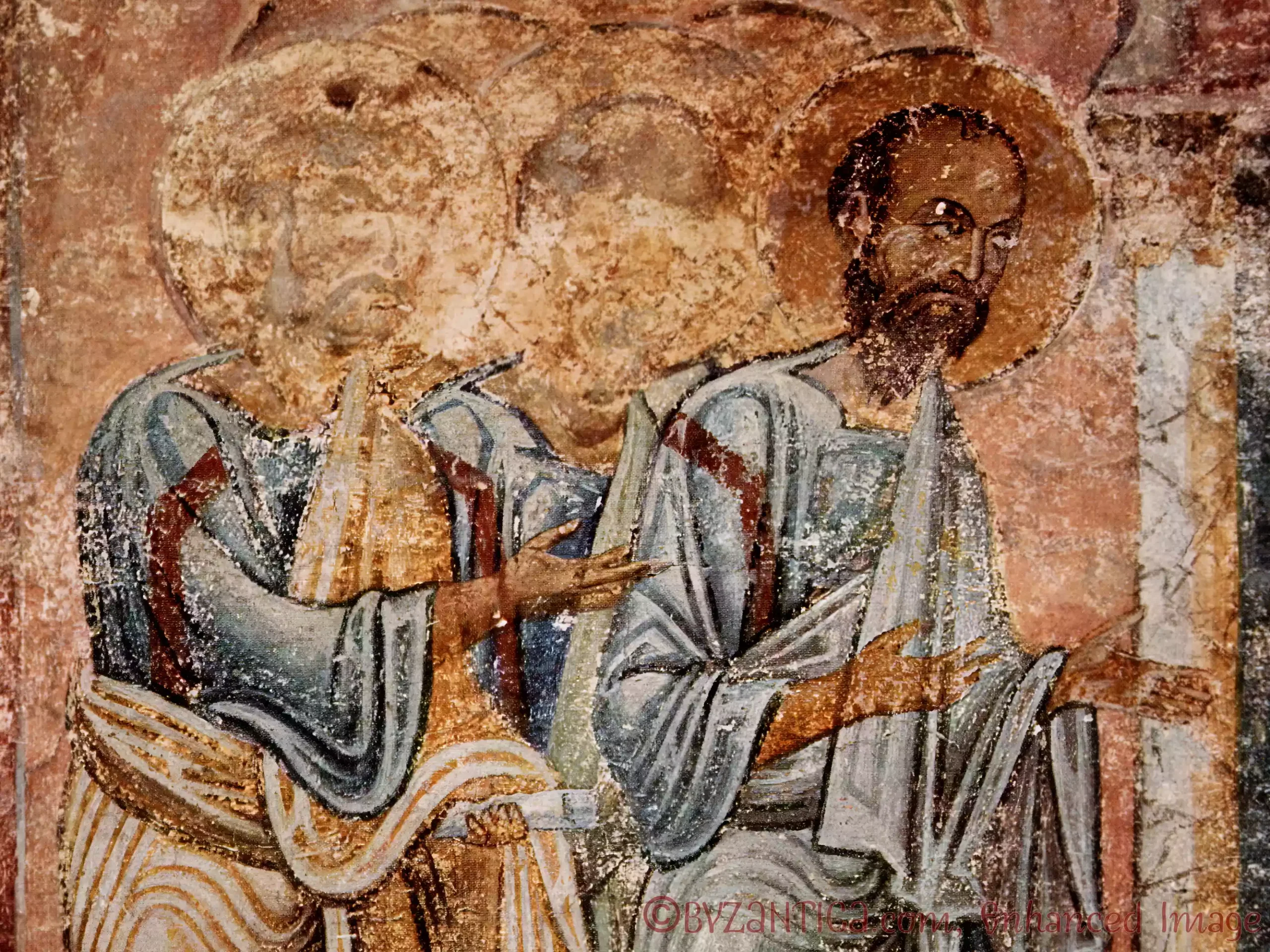 A close-up detail of the Apostles Communion scene showing intricate faces and haloes in the Byzantine fresco