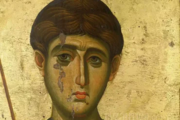 Detailed view of Saint Demetrios in Vatopedi icon showing the saint's face against golden background with expert brushwork