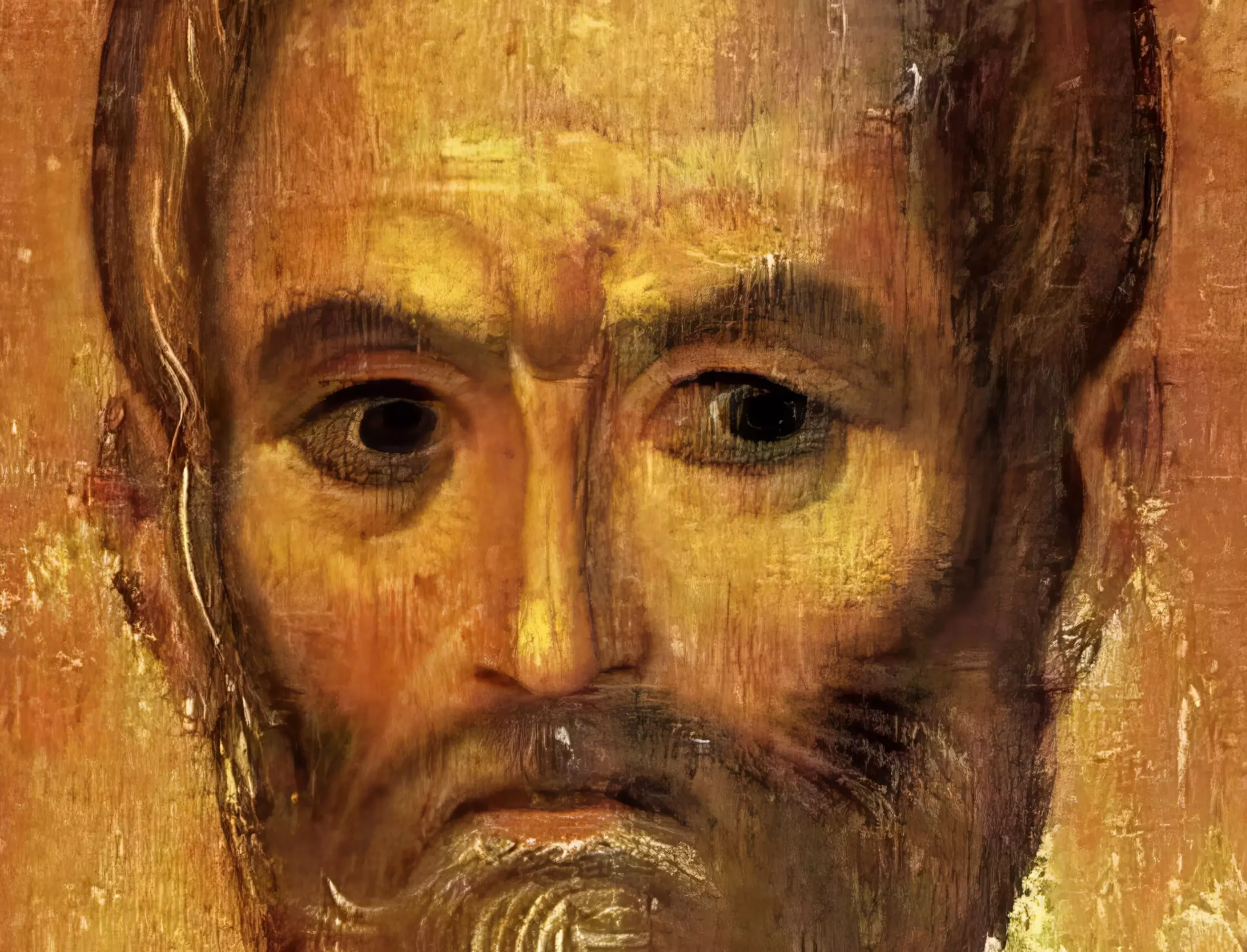 A detail showing the saint's intense gaze and masterful modeling of facial features in egg tempera and gold