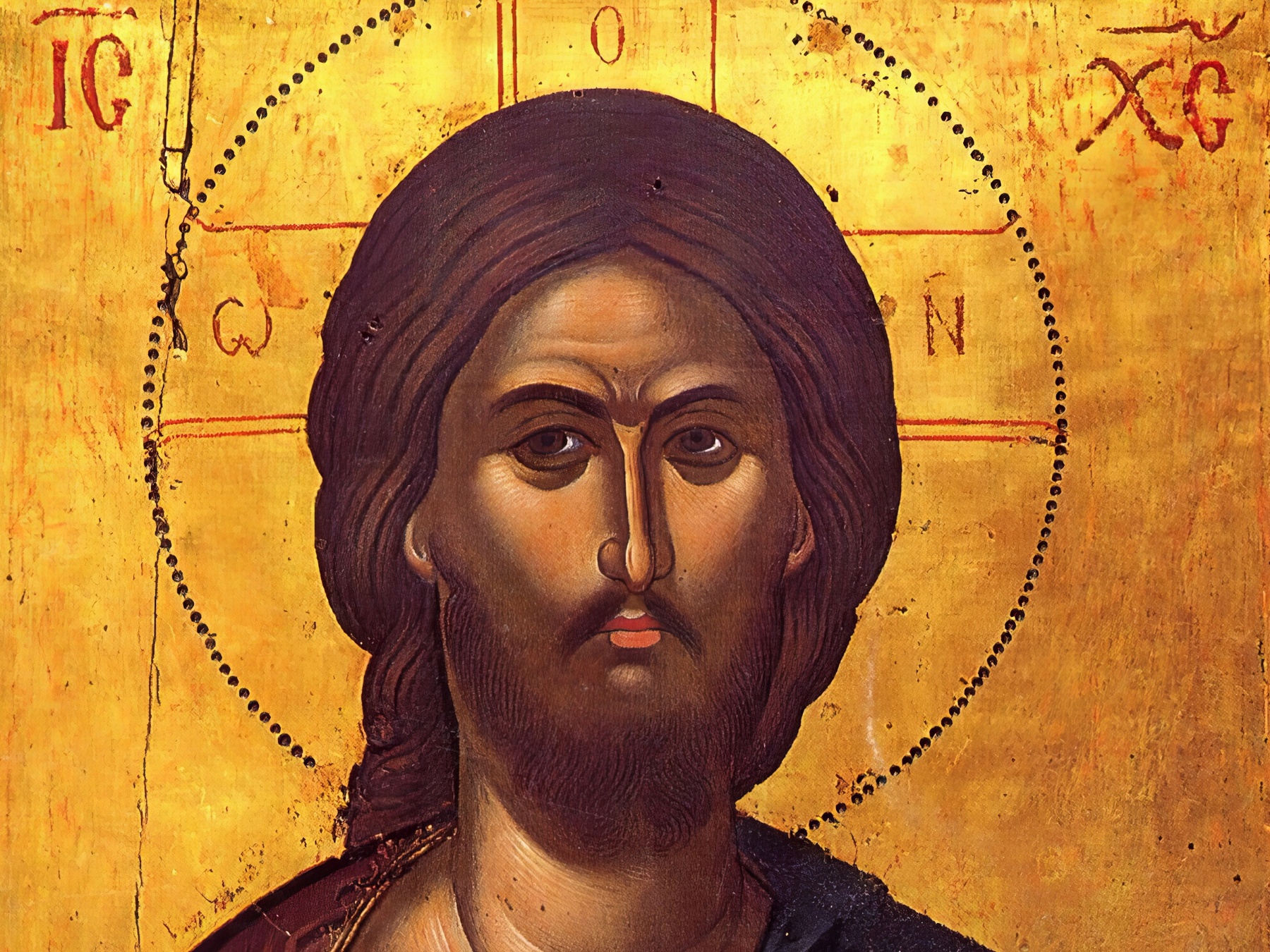 Face detail from Christ Pantocrator by Theophanes icon showing divine intensity in Byzantine style