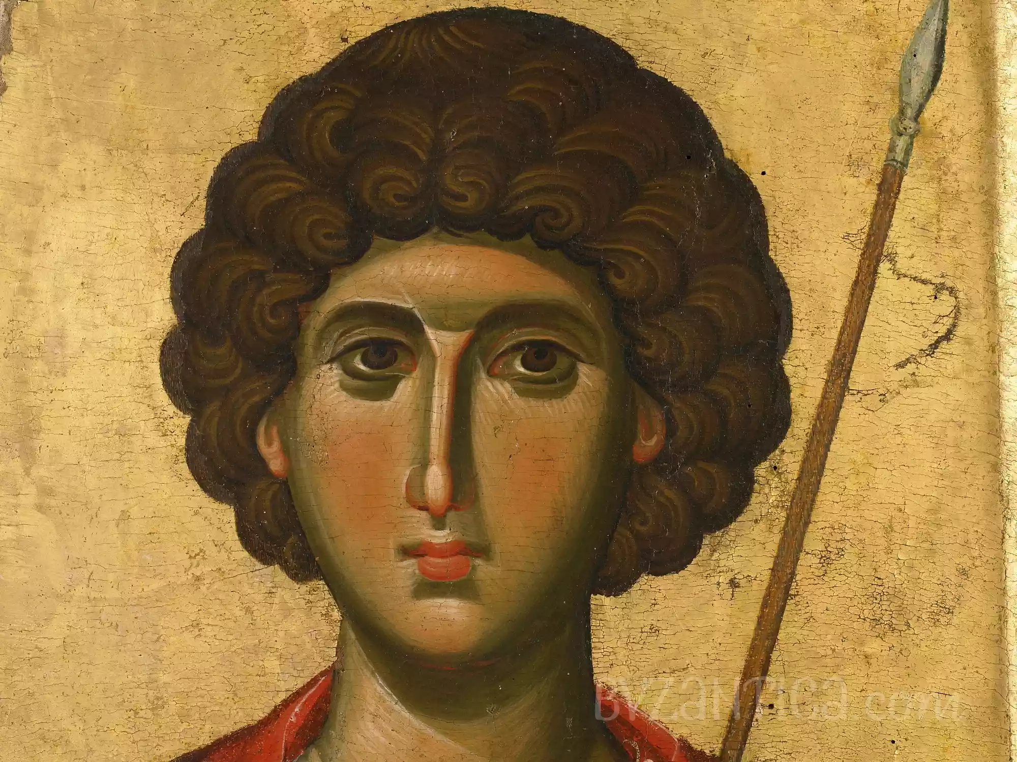 Detail of Saint George icon in Vatopedi showing facial features against gold background in Byzantine icon