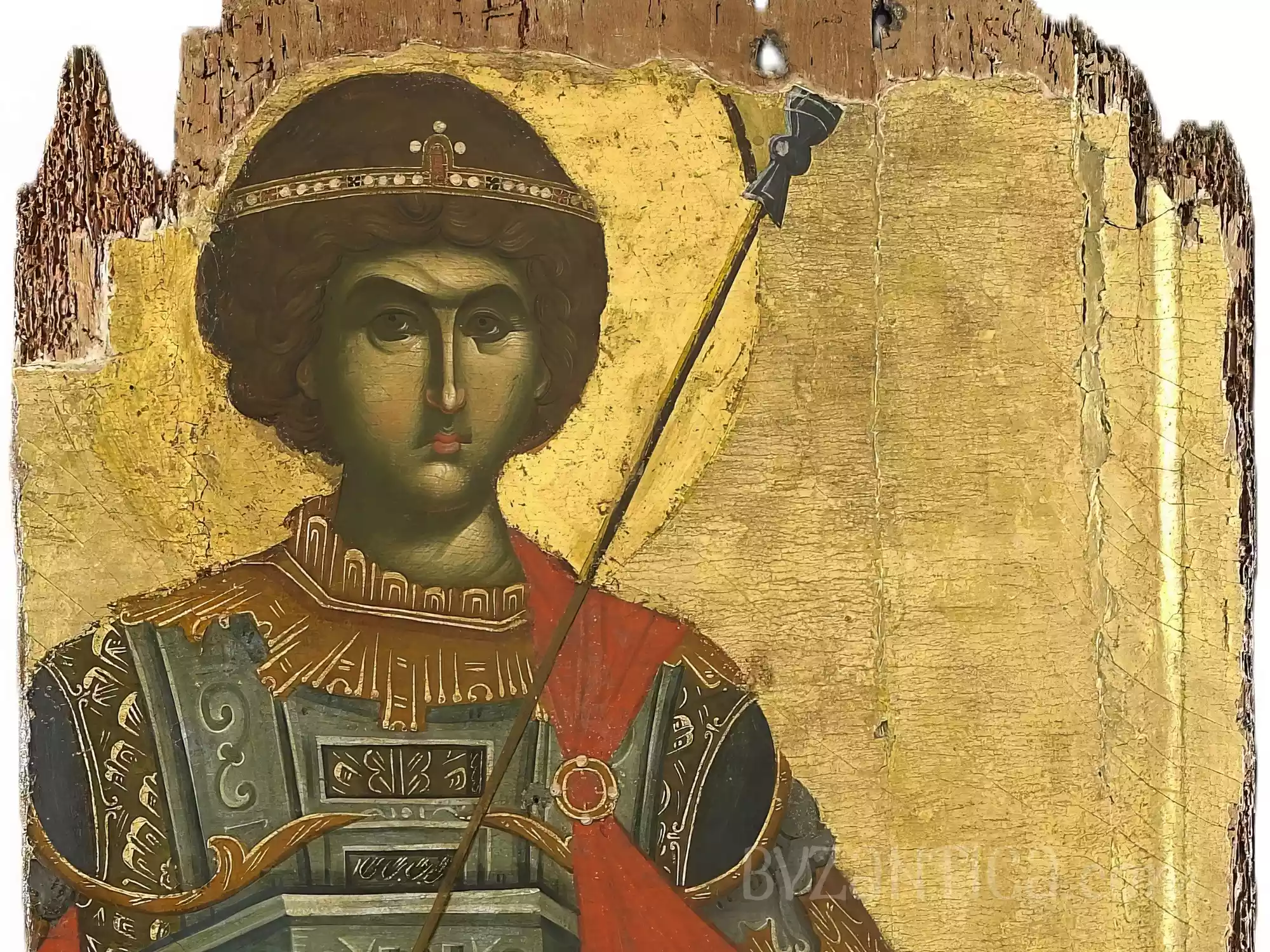 Face detail from Saint George in Vatopedi showing intense gaze in Byzantine icon against gold background