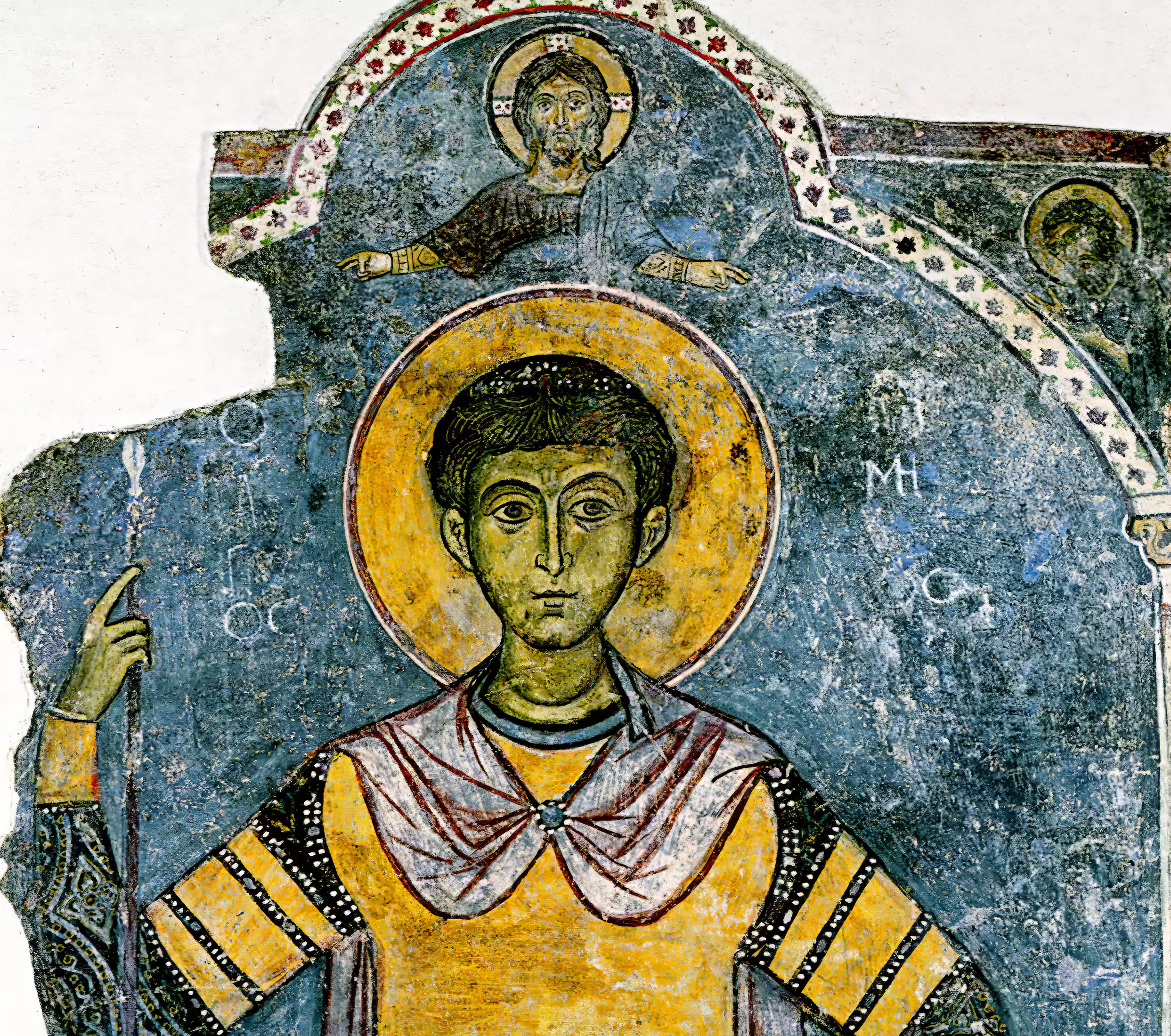 Detail showing the face and golden halo of Saint Demetrios against blue background, from 13th century Byzantine fresco at Kellia Church, Cyprus.