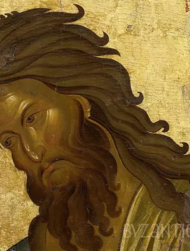 Detail view of Saint John Baptist in Vatopedi showing intense facial expression and flowing hair in Byzantine icon