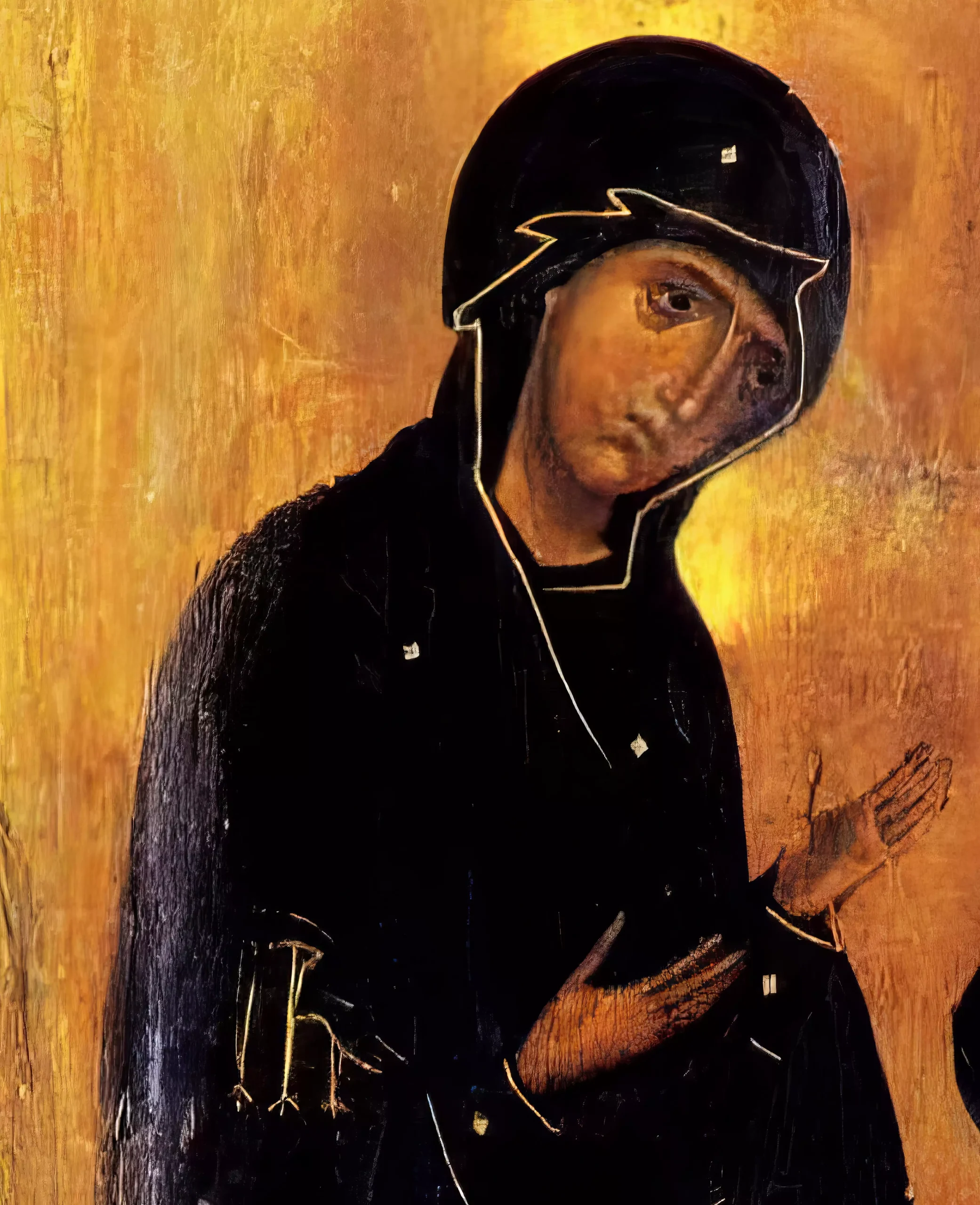 Detail of the Theotokos from the 11th century Sinai Deesis Icon, showing her characteristic tilted head and deep indigo maphorion against radiant gold ground