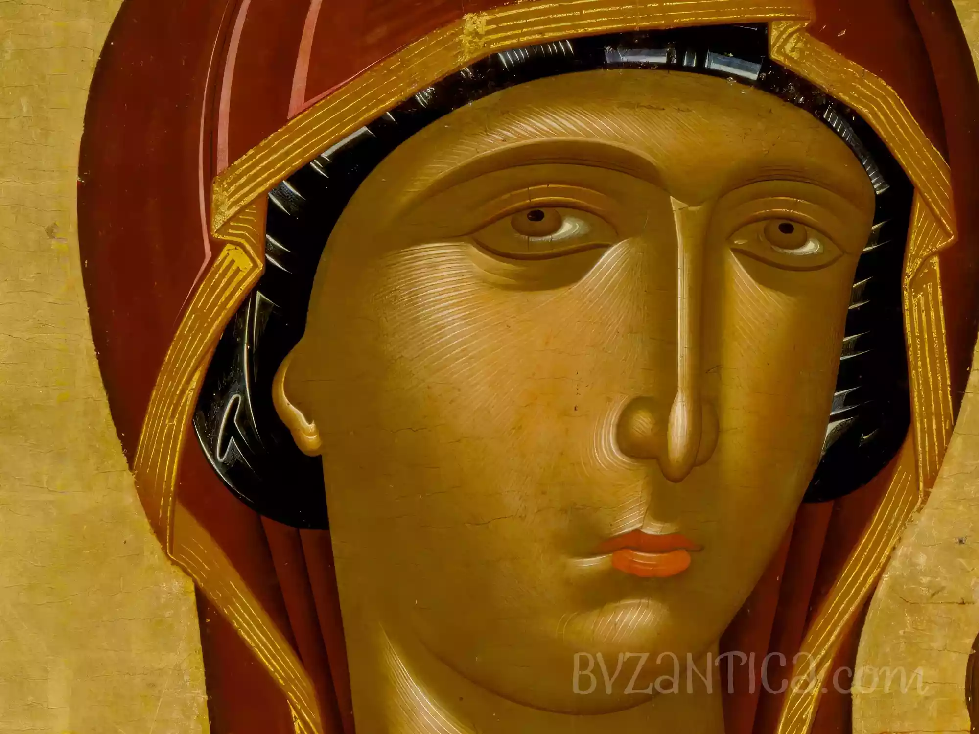 A detail of Virgin Hodegetria icon by Lambardos showing Mary's face against gold ground, Byzantine icon