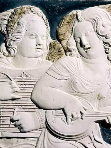 Angels in Sacred Stone: Musical angels playing divine harmonies in white marble relief at Tempio Malatestiano