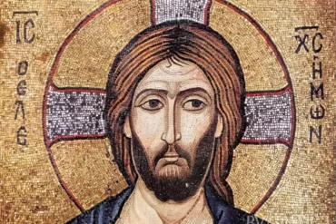 Close-up UHD detail of Christ Pantocrator mosaic in Berlin showing intricate facial features and golden background