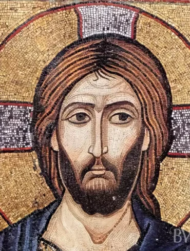 Close-up UHD detail of Christ Pantocrator mosaic in Berlin showing intricate facial features and golden background