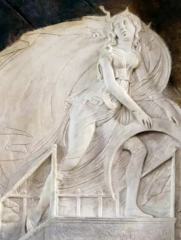 Planetary Chapel Rimini UHD marble relief detail showing celestial figure with flowing drapery above chariot