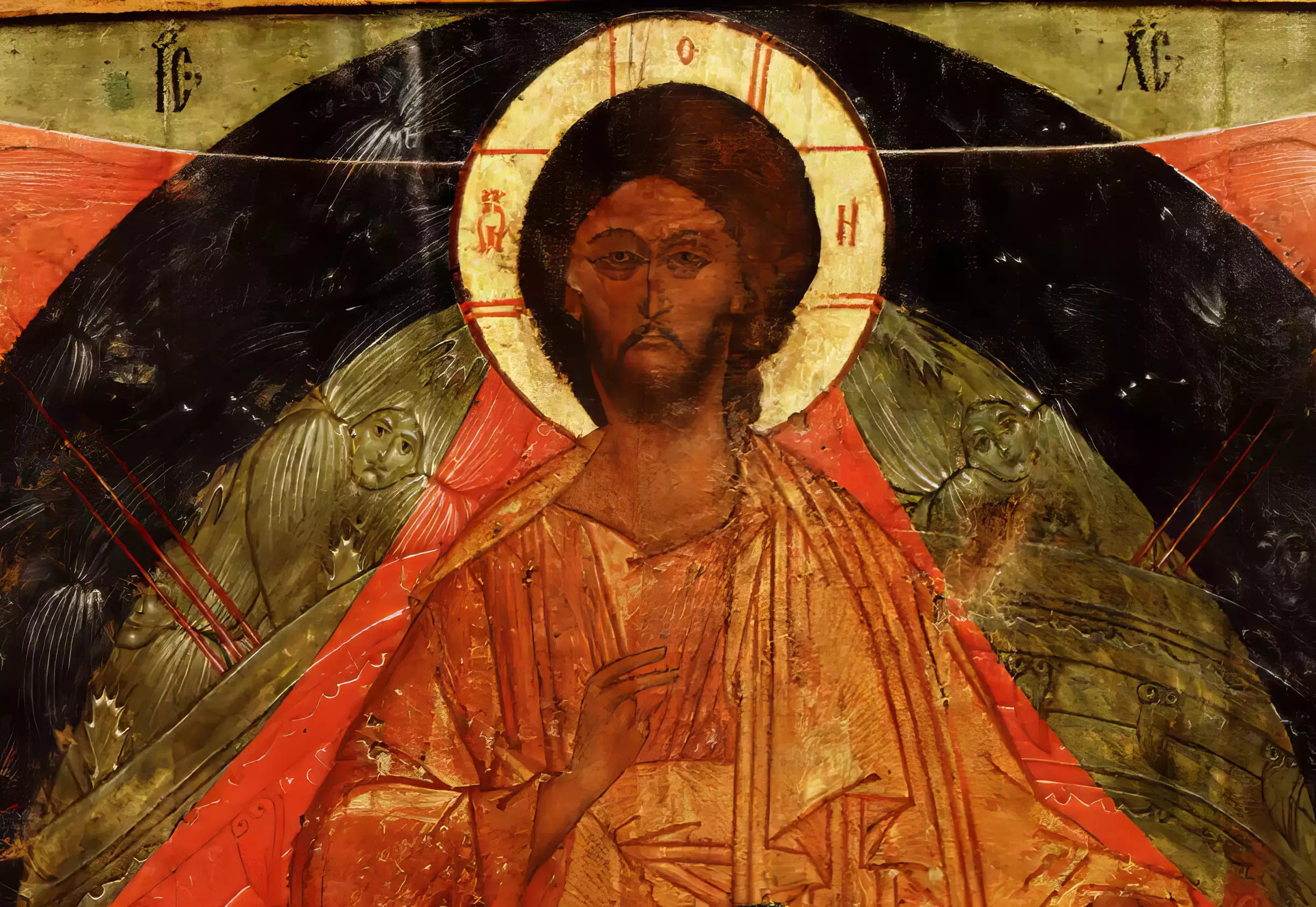 Close-up detail showing the face of Christ from a 16th-century Russian Orthodox icon, with characteristic nimbus and Slavonic inscriptions-2